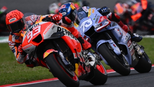 Ducati Spanish rider Alex Marquez (R) follows Honda Spanish rider Marc Marquez (L) as they  compete during the Italian MotoGP race at Mugello Circuit in Mugello, on June 11, 2023. (Photo by Filippo MONTEFORTE / AFP)