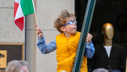 epa10910400 Spectators during the 79th Annual Columbus Day Parade in New York, USA, 09 October 2023. The parade celebrates Italian-American culture as well as the anniversary of Christopher Columbus's arrival in the Americas in 1492.  EPA/PORTER BINKS