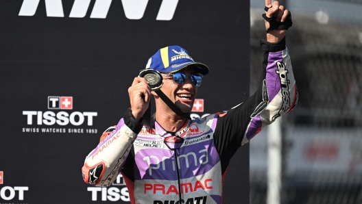 First-placed Prima Pramac Racings Spanish rider Jorge Martin celebrates on the podium following the sprint race of the Indonesian Grand Prix MotoGP at the Mandalika International Circuit in Kuta Mandalika, Central Lombok on October 14, 2023. (Photo by SONNY TUMBELAKA / AFP)