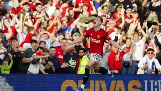 Manchester United's Scott McTominay celebrates scoring his side's second goal during the English Premier League soccer match between Manchester United and Brentford at the Old Trafford stadium in Manchester, England, Saturday, Oct. 7, 2023.(AP Photo/Jon Super)