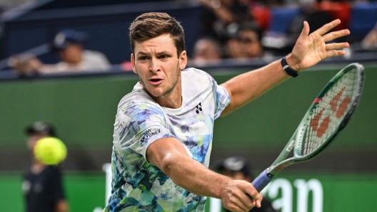 Poland's Hubert Hurkacz hits a return against Russia's Andrey Rublev during their men's singles final match at the Shanghai Masters tennis tournament in Shanghai on October 15, 2023. (Photo by Hector RETAMAL / AFP)