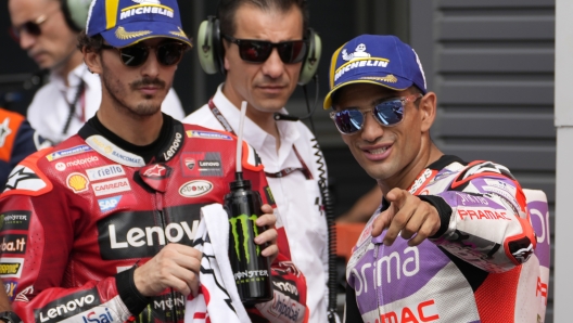 Spain's Jorge Martin, right, and Italy's Francesco Bagnaia, left, talk after the MotoGP qualification session for Sunday's Japanese Motorcycle Grand Prix at the Twin Ring Motegi circuit in Motegi, north of Tokyo Saturday Sept. 30, 2023. Martin took the pole position for Sunday's race. Martin took the pole position, followed by Bagnaia on the second grid. (AP Photo/Shuji Kajiyama)