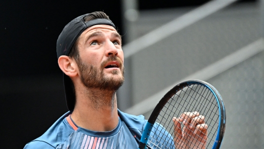 Italy's Andrea Vavassori reacts during his 2023 ATP Tour Madrid Open tennis tournament singles match against Russia's Daniil Medvedev at the Caja Magica in Madrid on April 29, 2023. (Photo by OSCAR DEL POZO / AFP)