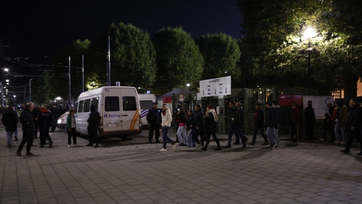 Supporters walk away from the venue after suspension of the Euro 2024 group F qualifying soccer match between Belgium and Sweden at the King Baudouin Stadium in Brussels, Monday, Oct. 16, 2023. The match was abandoned at halftime after two Swedes were killed in a shooting in central Brussels before kickoff. (AP Photo/Geert Vanden Wijngaert)