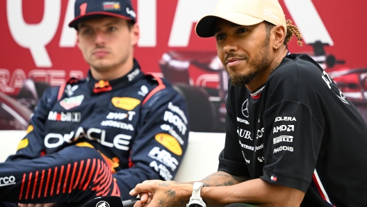 LUSAIL CITY, QATAR - OCTOBER 06: Third placed qualifier Lewis Hamilton of Great Britain and Mercedes and Pole position qualifier Max Verstappen of the Netherlands and Oracle Red Bull Racing attend the press conference after qualifying ahead of the F1 Grand Prix of Qatar at Lusail International Circuit on October 06, 2023 in Lusail City, Qatar. (Photo by Clive Mason/Getty Images)