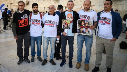 JERUSALEM, ISRAEL - OCTOBER 19: Family members and friends gather to pray for the safe return of those taken hostage by Hamas militants, at the Western Wall on October 19, 2023, in Jerusalem, Israel. As Israel prepares to invade the Gaza Strip in its campaign to vanquish Hamas, the Palestinian militant group that launched a deadly attack in southern Israel on October 7th, worries are growing of a wider war with multiple fronts, including at the country's northern border with Lebanon. Countries have scrambled to evacuate their citizens from Israel, and Israel has begun relocating residents some communities on its northern border. Meanwhile, hundreds of thousands of residents of northern Gaza have fled to the southern part of the territory, following Israel's vow to launch a ground invasion. (Photo by Leon Neal/Getty Images)