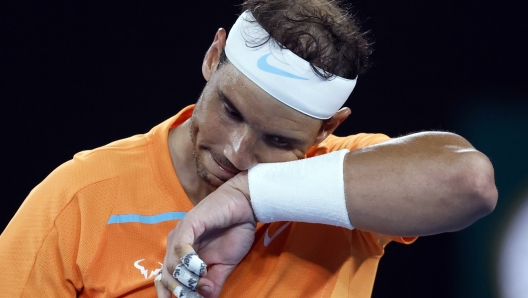 FILE - Rafael Nadal, of Spain, wipes the sweat from his face during his second round match against Mackenzie McDonald of the U.S., at the Australian Open tennis championship in Melbourne, Australia, Wednesday, Jan. 18, 2023. Nadal has pulled out of the French Open because of a lingering hip injury that has sidelined him since January and says that he expects 2024 to be his last year on the tennis tour. (AP Photo/Asanka Brendon Ratnayake, File)