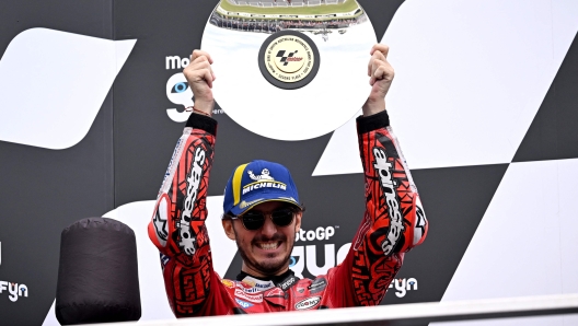 Second placed Ducati Lenovo Team's Italian rider Francesco Bagnaia celebrates on the podium after the MotoGP Australian Grand Prix at Phillip Island on October 21, 2023. (Photo by WILLIAM WEST / AFP) / -- IMAGE RESTRICTED TO EDITORIAL USE - STRICTLY NO COMMERCIAL USE --