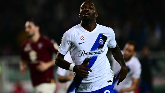 Inter Milan's French forward #09 Marcus Thuram celebrates after scoring during the Italian Serie A football match between Torino and Inter Milan, at Torino's Olympic Stadium, in Turin on October 21, 2023. (Photo by Marco BERTORELLO / AFP)