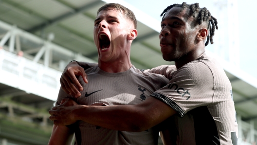 LUTON, ENGLAND - OCTOBER 07: Micky van de Ven of Tottenham Hotspur celebrates with teammate Destiny Udogie after scoring the team's first goal during the Premier League match between Luton Town and Tottenham Hotspur at Kenilworth Road on October 07, 2023 in Luton, England. (Photo by Henry Browne/Getty Images)