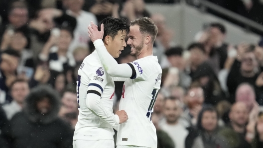 Tottenham's Son Heung-min, left, and Tottenham's James Maddison during the English Premier League soccer match between Tottenham Hotspur and Fulham at the Tottenham Hotspur Stadium in London, Monday, Oct. 23, 2023. (AP Photo/Kin Cheung)