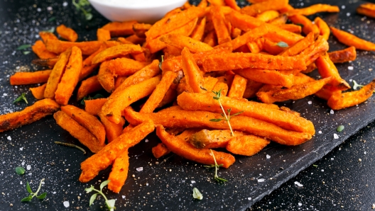 Healthy Homemade Baked Orange Sweet Potato Fries with fresh cream dip souce, herbs, salt and pepper