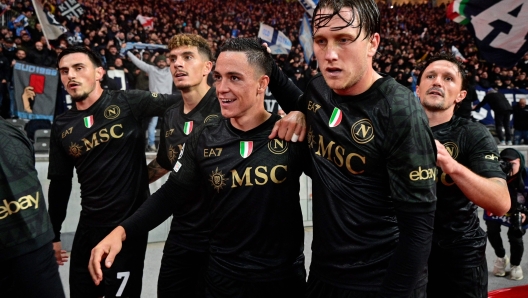 Napoli's Italian forward #81 Giacomo Raspadori (C) celebrates scoring the opening goal with his teammates and fans during the UEFA Champions League group C football match 1 FC Union Berlin v SSC Napoli at the Olympic Stadium in Berlin on October 24, 2023. (Photo by John MACDOUGALL / AFP)