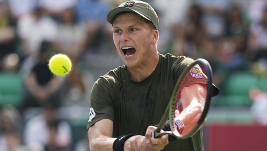 FILE - Jenson Brooksby, of the United States, hits a return to Denis Shapovalov, of Canada, at the Korea Open tennis tournament in Seoul, South Korea, Oct. 1, 2022. Brooksby tells The Associated Press he has accepted a provisional suspension from the International Tennis Integrity Agency after being accused of missing three doping tests in a 12-month period. Brooksby plans to go to arbitration. (AP Photo/Lee Jin-man, File)