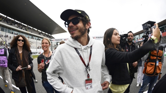 Former MotoGP world champion Valentino Rossi of Italy walks at the track during the Algarve Motorcycle Grand Prix, at the Algarve International circuit near Portimao, Portugal, Sunday, April 24, 2022. (AP Photo/Jose Breton)