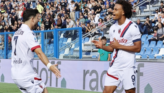 Bologna's   Joshua Zirkzee    jubilates with his teammate Riccardo Orsolini after scoring the goal during the Italian Serie A soccer match US Sassuolo vs Bologna FC at Mapei Stadium in Reggio Emilia, Italy, 28 October 2023. ANSA / SERENA CAMPANINI