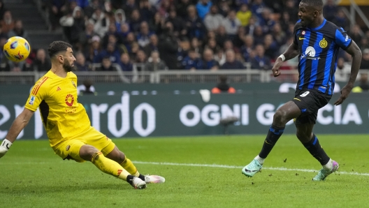 Inter Milan's Marcus Thuram, right, scores his side's opening goal during the Serie A soccer match between Inter Milan and Roma at the San Siro Stadium, in Milan, Italy, Sunday, Oct. 29, 2023. (AP Photo/Antonio Calanni)