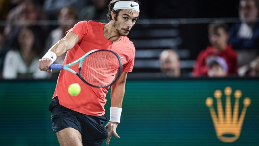 epa10949444 Lorenzo Musetti of Italy in action against Grigor Dimitrov of Bulgaria during their first round match at the Rolex Paris Masters tennis tournament in Paris, France, 30 October 2023.  EPA/CHRISTOPHE PETIT TESSON