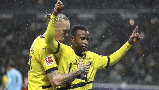 FRANKFURT AM MAIN, GERMANY - OCTOBER 29: Youssoufa Moukoko of Borussia Dortmund celebrates with Marius Wolf after scoring the team's second goal during the Bundesliga match between Eintracht Frankfurt and Borussia Dortmund at Deutsche Bank Park on October 29, 2023 in Frankfurt am Main, Germany. (Photo by Christof Koepsel/Getty Images)