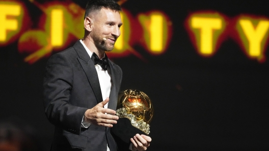 Inter Miami's and Argentina's national team player Lionel Messi receives the 2023 Ballon d'Or trophy during the 67th Ballon d'Or (Golden Ball) award ceremony at Theatre du Chatelet in Paris, France, Monday, Oct. 30, 2023. (AP Photo/Michel Euler)