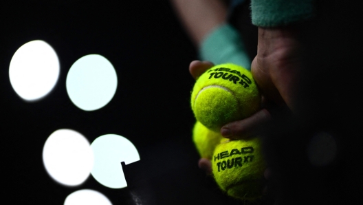 A ball kid keeps tennis ball during the men's singles quarter-final match between Greece's Stefanos Tsitsipas and Karen Khachanov on day five of the Paris ATP Masters 1000 tennis tournament at the Accor Arena - Palais Omnisports de Paris-Bercy - in Paris on November 3, 2023. (Photo by JULIEN DE ROSA / AFP)