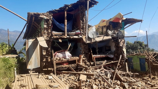 TOPSHOT - Damaged houses lie in ruins, in the aftermath of an earthquake at Pipaldanda village of Jajarkot district on November 4, 2023. At least 132 people were killed in an overnight earthquake that struck a remote pocket of Nepal, officials said on November 4, as security forces rushed to assist with rescue efforts. (Photo by Balkumar Sharma / AFP)