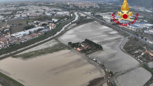 Veduta aerea delle zona alluvionate a Campi Bisenzio, 04 novembre 2023. ANSA/VIGILI DEL FUOCO +++ ANSA PROVIDES ACCESS TO THIS HANDOUT PHOTO TO BE USED SOLELY TO ILLUSTRATE NEWS REPORTING OR COMMENTARY ON THE FACTS OR EVENTS DEPICTED IN THIS IMAGE; NO ARCHIVING; NO LICENSING +++ NPK +++