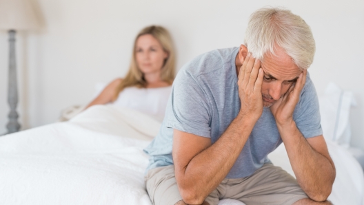 Upset mature couple ignoring each other. Close up of a worried senior man in tension at bed. Senior couple angry with each other after a fight.