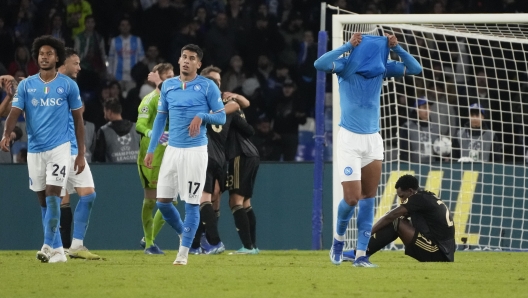 Napoli's Natan covers his face in dejection at the end of the Champions League, Group C, soccer match between Napoli and Union Berlin at the Diego Maradona stadium, in Naples, Italy, Wednesday, Nov. 8, 2023. (AP Photo/Gregorio Borgia)