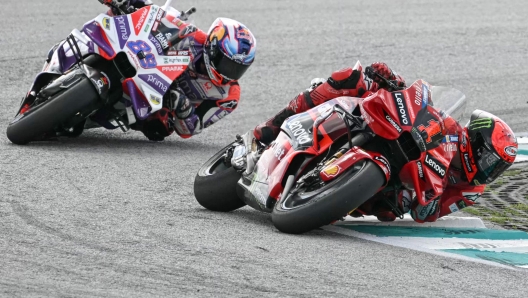 Ducati Lenovo Team's Italian rider Francesco Bagnaia competes ahead of Prima Pramac's Spanish rider Jorge Martin during the MotoGP Malaysian Grand Prix at the Sepang International Circuit in Sepang on November 12, 2023. (Photo by MOHD RASFAN / AFP)