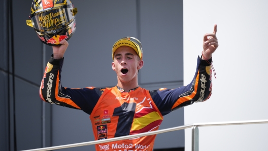 Spanish rider Pedro Acosta celebrates his 2023 Moto2 World Champion after the Moto2 class race of the MotoGP Malaysian Grand Prix at the Sepang, Malaysia Sunday, Nov. 12, 2023. (AP Photo/Vincent Thian)