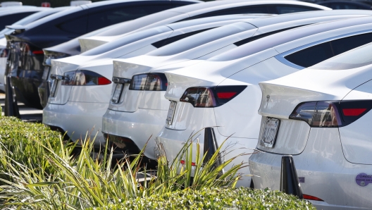 epa10967730 Cars sit on a lot at a Tesla showroom in Burbank, California, USA, 09 November 2023. According to Cox Automotive, electric car sales went up to 7.9 percent of total industry sales in the third quarter, which is up from 6.1 percent a year ago. However, electric vehicles are lingering longer on dealership lots, taking 88 days to sell their entire supply, compared to 39 days in October 2022, according to Cox Automotive."  EPA/CAROLINE BREHMAN