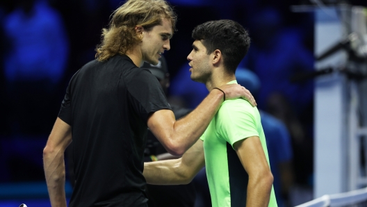 TURIN, ITALY - NOVEMBER 13:  Alexander Zverev of Germany shakes hands at the net after his three set victory against Carlos Alcaraz of Spain during the Round Robin match on day two of the Nitto ATP Finals at Pala Alpitour on November 13, 2023 in Turin, Italy. (Photo by Clive Brunskill/Getty Images)