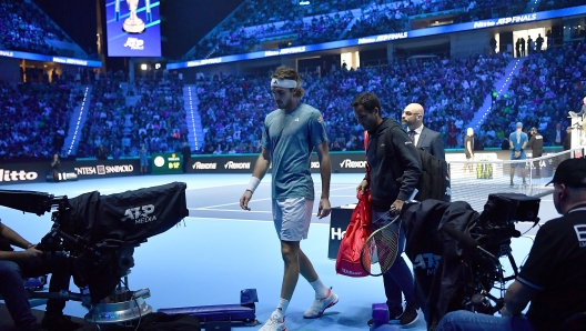 TURIN, ITALY - NOVEMBER 14:  Stefanos Tsitsipas of Greece looks dejected after retiring in the Men's Singles Round Robin match against Holger Rune of Denmark on day three of the Nitto ATP Finals at Pala Alpitour on November 14, 2023 in Turin, Italy.  (Photo by Valerio Pennicino/Getty Images)