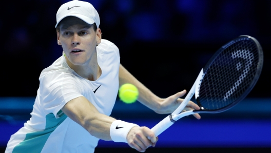 TURIN, ITALY - NOVEMBER 14: Jannik Sinner of Italy plays a backhand against Novak Djokovic of Serbia during the Men's Singles Round Robin match on day three of the Nitto ATP Finals at Pala Alpitour on November 14, 2023 in Turin, Italy. (Photo by Clive Brunskill/Getty Images)