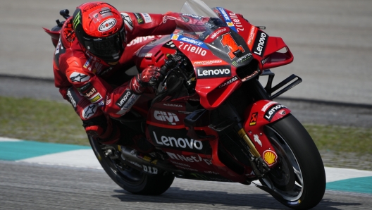 Francesco Bagnaia steers his bike during the MotoGP class race of the MotoGP Malaysian Grand Prix at the Sepang, Malaysia Sunday, Nov. 12, 2023. (AP Photo/Vincent Thian)