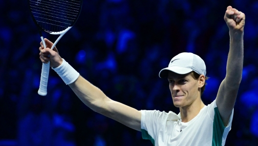 Italy's Jannik Sinner celebrates after winning his round-robin match against Serbia's Novak Djokovic on day 3 of the ATP Finals tennis tournament in Turin on November 14, 2023. (Photo by Tiziana FABI / AFP)