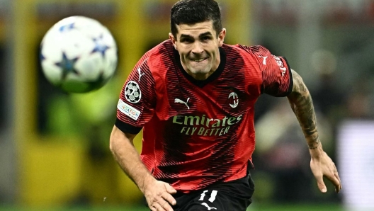 (FILES) AC Milan's American forward #11 Christian Pulisic runs for the ball during the UEFA Champions League 1st round group F football match between AC Milan and Paris Saint-Germain at the San Siro stadium in Milan on November 7, 2023. AC Milan winger Christian Pulisic and Juventus forward Timothy Weah have both been ruled out of the United States squad for the upcoming CONCACAF Nations League qualifiers with Trinidad and Tobago. USA coach Gregg Berhalter named his 24-man squad for the pair of games against the Caribbean team on November 9, 2023, and the two wide-men were the most noticable absences. (Photo by GABRIEL BOUYS / AFP)