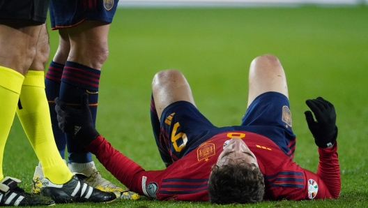 Spain's midfielder #09 Gavi lies on the lawn during the UEFA Euro 2024 group A qualifying football match between Spain and Georgia at the Jose Zorrilla stadium in Valladolid on November 19, 2023. (Photo by CESAR MANSO / AFP)