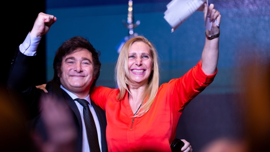 BUENOS AIRES, ARGENTINA - NOVEMBER 19: Newly elected President of Argentina Javier Milei of La Libertad Avanza celebrates with his sister Karina Milei after the polls closed in the presidential runoff on November 19, 2023 in Buenos Aires, Argentina. According to official results, Javier Milei of La Libertad Avanza reached 55,69% of the votes and Sergio Massa of Union Por La Patria 44,30%, with 99,25 of the votes counted. The presidential election runoff to succeed Alberto Fernandez comes as Argentinians have been hard hit by an annual 142,7% inflation. (Photo by Tomas Cuesta/Getty Images)