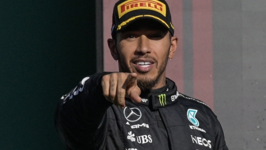 Mercedes' British driver Lewis Hamilton celebrates on the podium after placing second after the Formula One Mexico Grand Prix at the Hermanos Rodriguez racetrack in Mexico City on October 29, 2023. (Photo by Alfredo ESTRELLA / AFP)