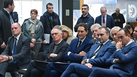 John Elkann presidente Stellantis, Alberto Cirio presifdente regione piemonte, Carlo Tavares A.D. Stellantis e Stefano Lo Russo sindaco di Torino durante l' anteprima stampa della mostra multimediale Drive Different.DallAusterity alla mobilità del futuro presso museo Mauto di Torino, 23 novembre 2023. ANSA/ALESSANDRO DI MARCO