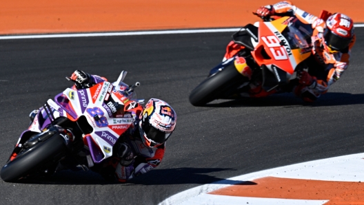 Ducati Spanish rider Jorge Martin rides ahead of Honda Spanish rider Marc Marquez during the first free practice session of the MotoGP Valencia Grand Prix at the Ricardo Tormo racetrack in Cheste, on November 24, 2023. (Photo by JAVIER SORIANO / AFP)