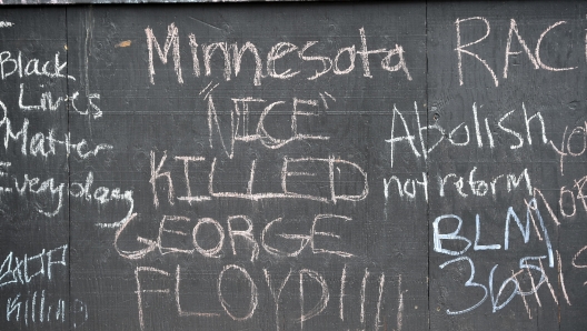 epa09146299 Protesters left notes on a boarded up windows across the street from the Hennepin County Government Center where the first day of closing arguments for the murder trial of former Minneapolis police officer Derek Chauvin who was charged in the death of George Floyd are being held, in Minneapolis, Minnesota, USA, 19 April 2021.  EPA/CRAIG LASSIG