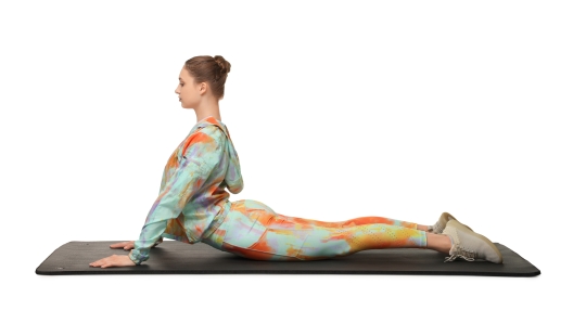 Young woman practicing yoga on white background