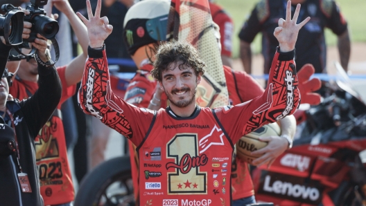 epa10996310 Italian MotoGP rider Francesco Bagnaia of Ducati Lenovo celebrates becoming World Champion after his win in the motorcycling Grand Prix of Valencia at Ricardo Tormo circuit in Cheste, Valencia, Spain, 26 November 2023.  EPA/BIEL ALINO