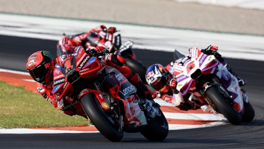 Ducati Italian rider Francesco Bagnaia rides ahead of Ducati French rider Johann Zarco during the MotoGP Valencia Grand Prix at the Ricardo Tormo racetrack in Cheste, on November 26, 2023. (Photo by JOSE JORDAN / AFP)