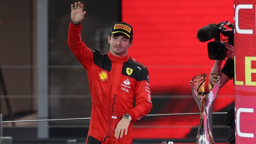 epa10996346 Second placed Monaco's Formula One driver Charles Leclerc of Scuderia Ferrari waves on the podium after the Formula 1 Abu Dhabi Grand Prix in Abu Dhabi, United Arab Emirates, 26 November 2023.  EPA/ALI HAIDER