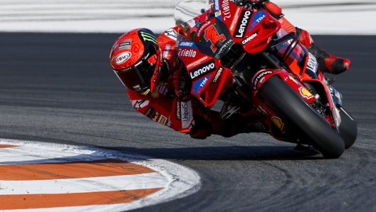 Italian rider Francesco Bagnaia of the Ducati Lenovo Team steers his motorcycle during warm up prior the MotoGP race of the Valencia Motorcycle Grand Prix, the last race of the season, at the Ricardo Tormo circuit in Cheste near Valencia, Spain, Sunday, Nov. 26, 2023. (AP Photo/Alberto Saiz)