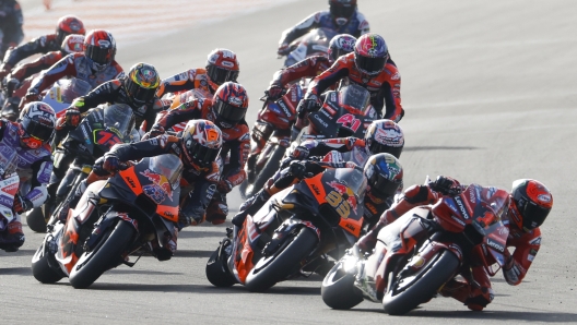 Italian rider Francesco Bagnaia of the Ducati Lenovo Team leads the pack at the start of the MotoGP race of the Valencia Motorcycle Grand Prix, the last race of the season, at the Ricardo Tormo circuit in Cheste near Valencia, Spain, Sunday, Nov. 26, 2023. (AP Photo/Alberto Saiz)